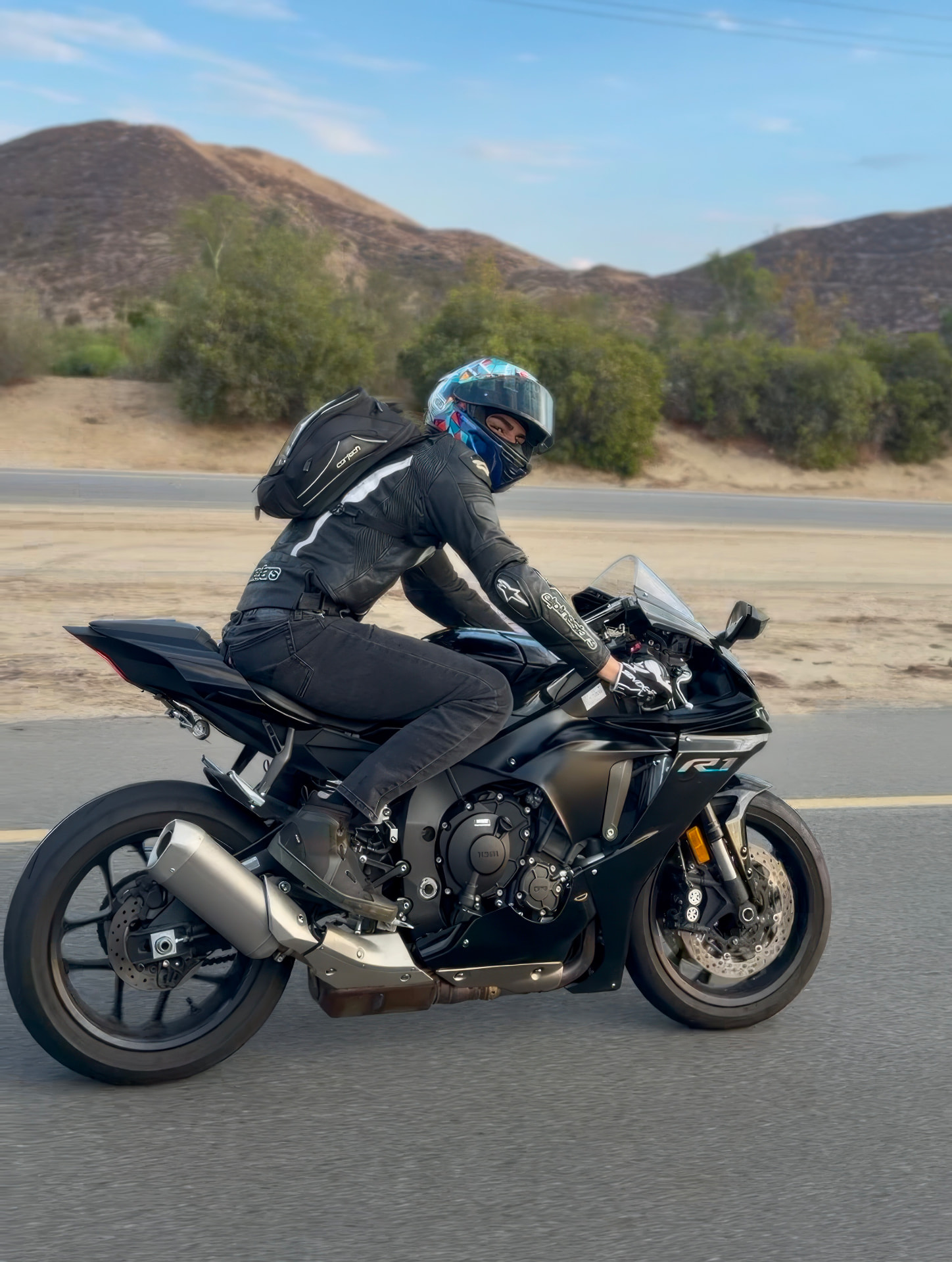 Rennsport founder riding his Yamaha R1 on a canyon road